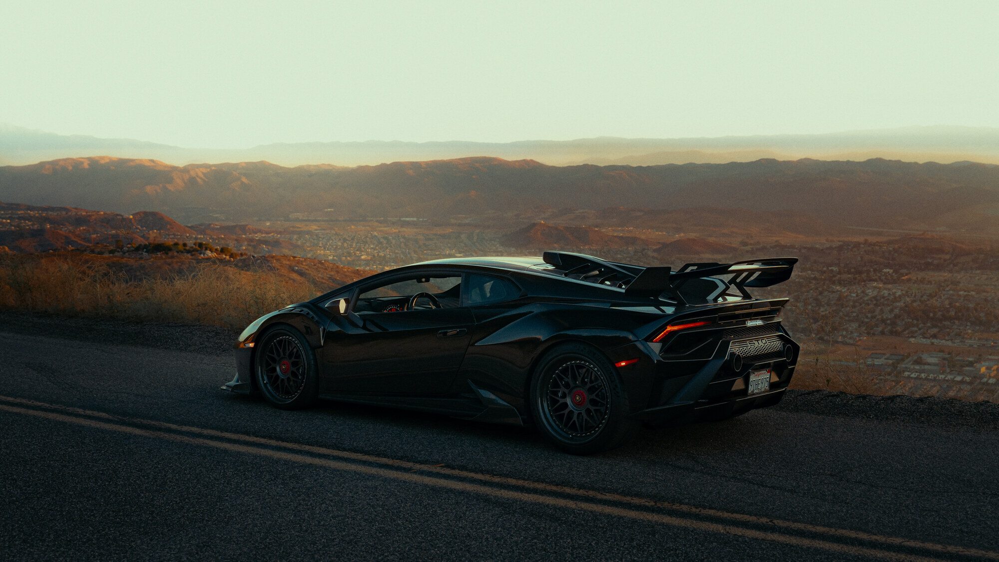 Lamborghini Huracán STO — rear three-quarter